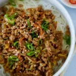 Close up of Spring Roll Bowls Stir-fry with chopsticks
