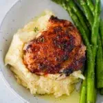 Garlic Butter Chicken Thighs with mashed potatoes and asparagus