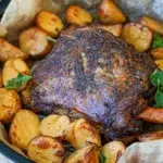 Delicious Slow Cooker Lamb Shoulder with vegetables, garnished and ready for serving