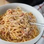 Close-up of Caramelised onion pasta served in a bowl, showcasing the texture and ingredients.