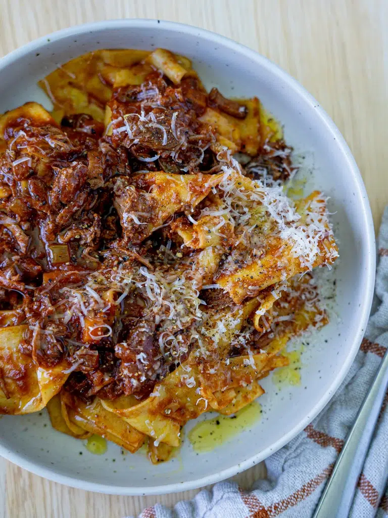 Warm and comforting slow cooker beef ragu with a rich, deep color.