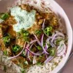 Serving of Lamb Korma in a pink bowl