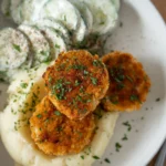 plated chicken rissoles close up overhead
