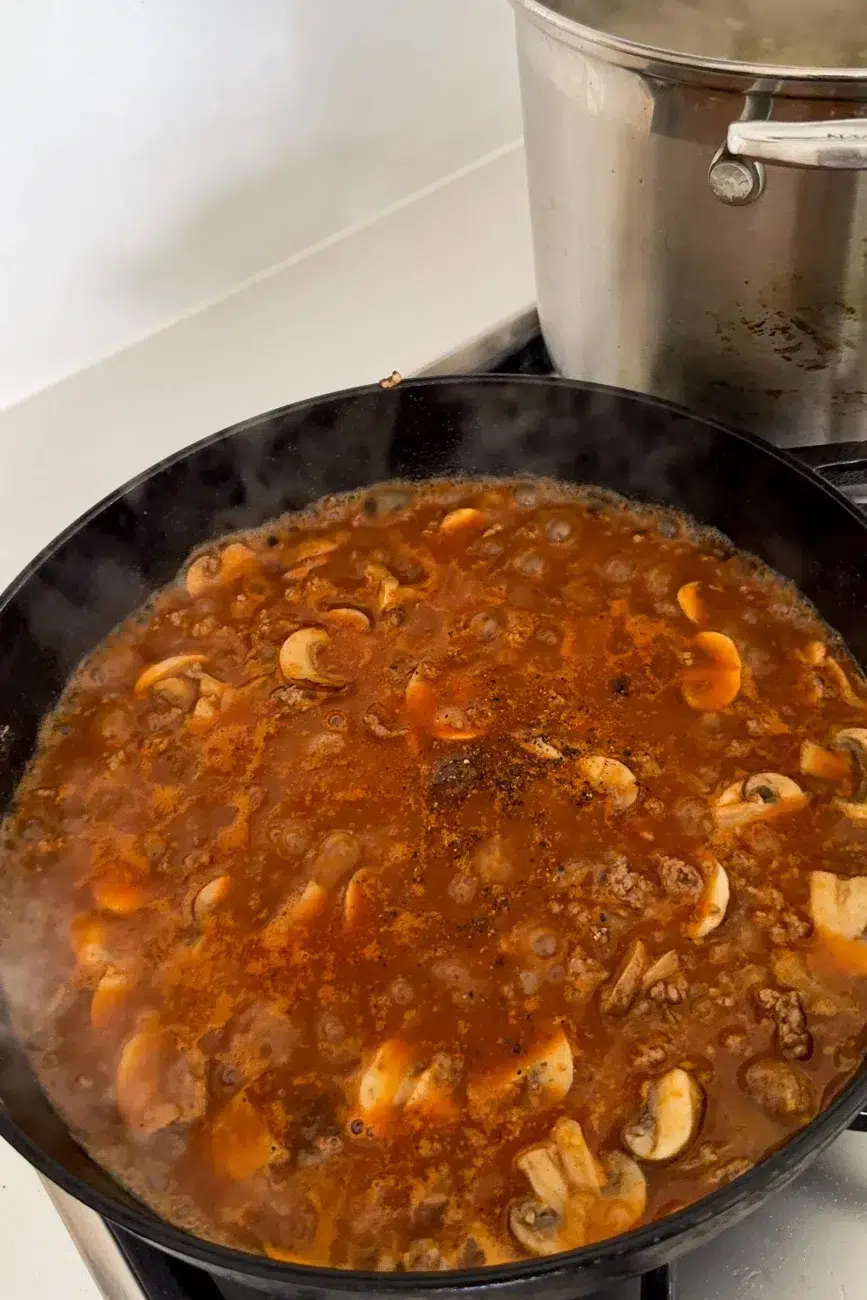 simmering beef stroganoff with deep rich colour