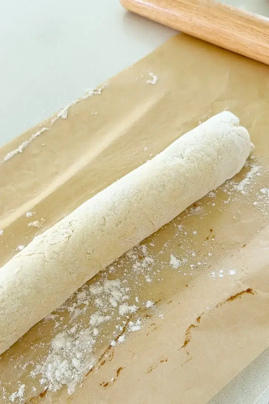 Dough rolled into a log for cinnamon scrolls