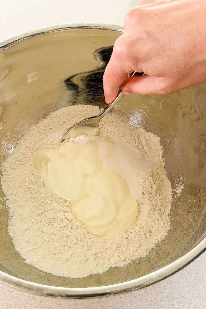 Mixing dough ingredients for Easy no yeast cinnamon scrolls