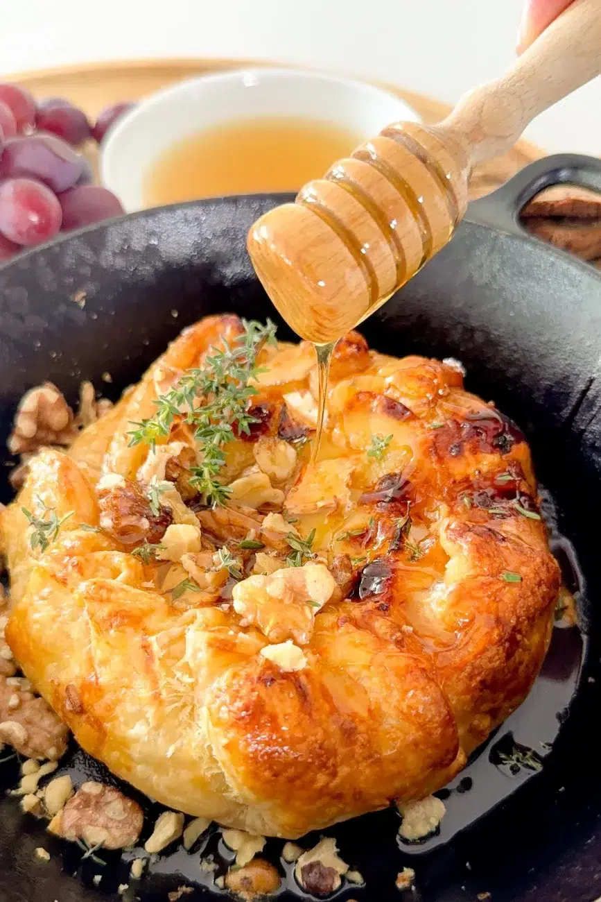 Baked Brie encased in puff pastry drizzled with honey