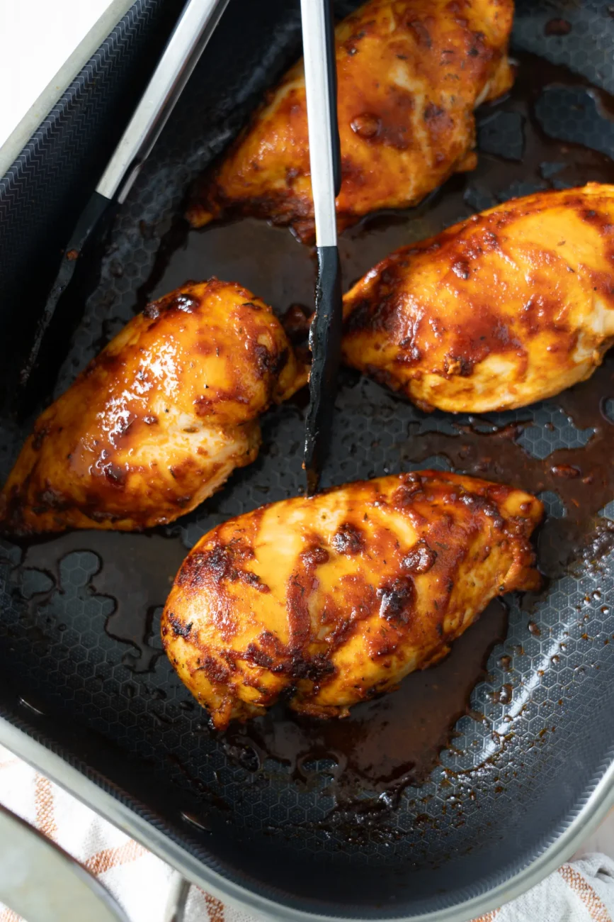Finished juicy whole baked chicken breast rotisserie style