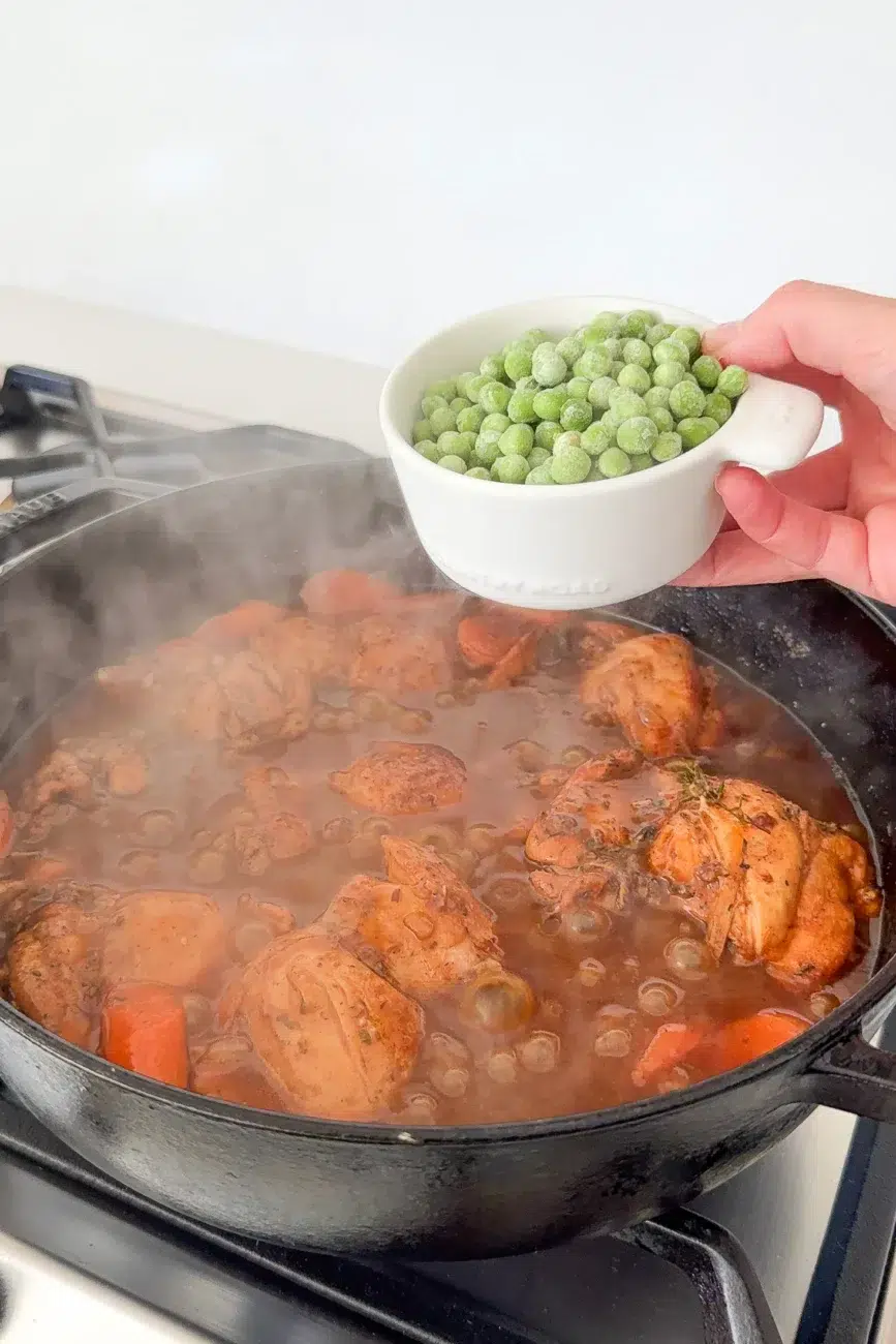 Peas being added to pan in last 5 mins of cooking