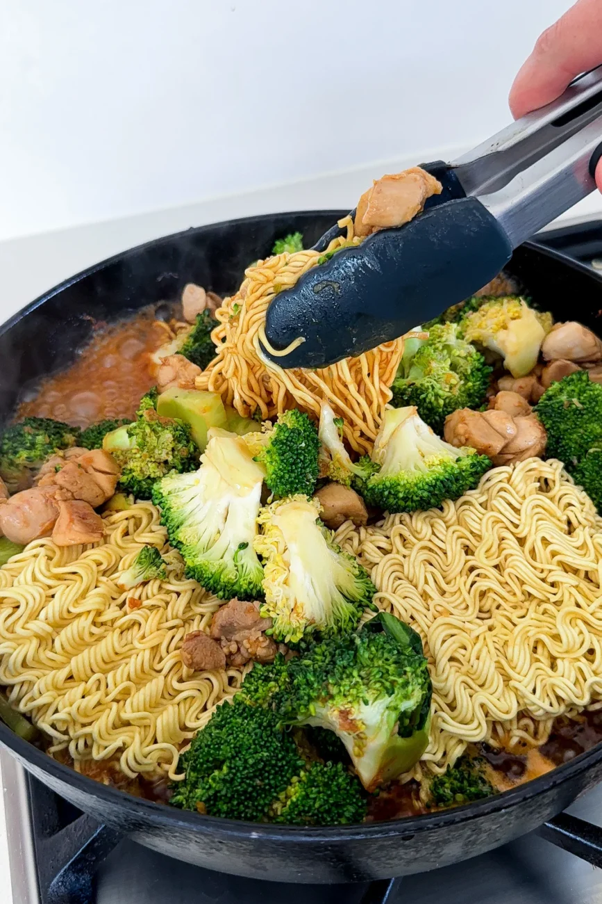 Ramen noodles starting to soften in pan