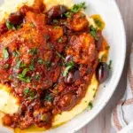 Rich tomato sauce, tender chicken and creamy parmesan polenta served in a bowl