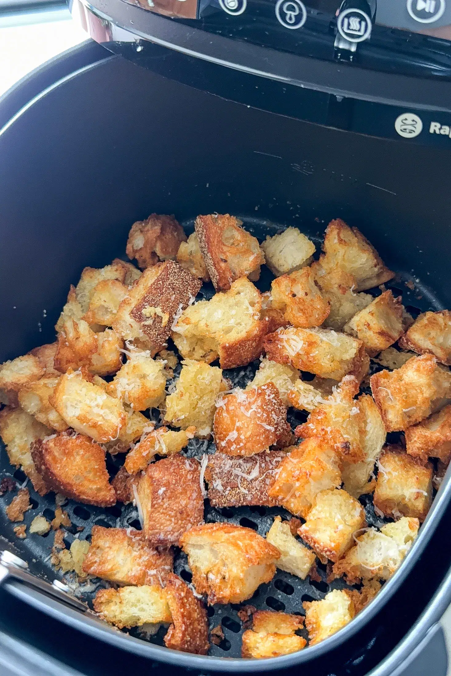 Crispy golden garlic parmesan croutons fresh from the air fryer