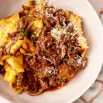 Slow-cooked beef and mushroom ragu served over fresh pappardelle with parmesan