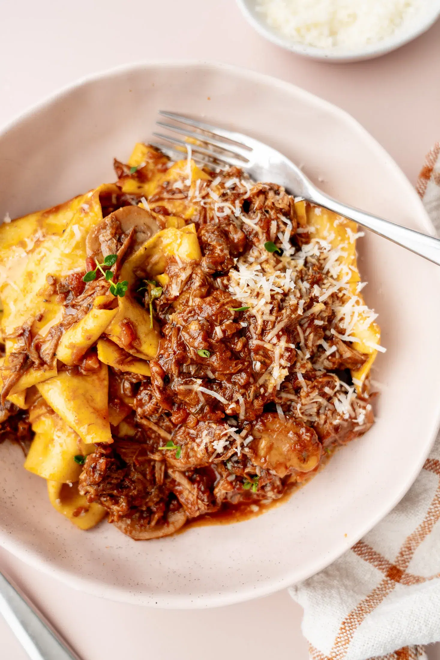 Fork twirled through pappardelle and slow-cooked beef mushroom ragu