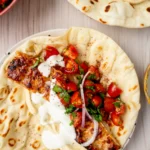 Top view of one flatbread with topping close-up