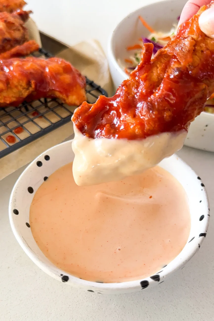 Chicken brushed with honey BBQ sauce and dipped in comeback sauce
