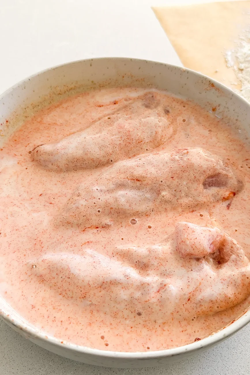 Chicken tender dredged in wet ingredients