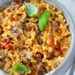 Creamy tomato pasta recipe with parmesan cheese and chilli