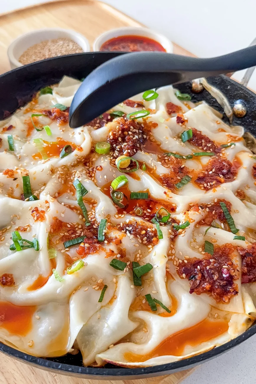 Dumpling lasagne topped with dumpling dressing ready to be served