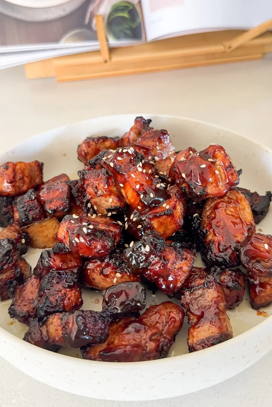 Finished pork belly with glaze and sesame seeds