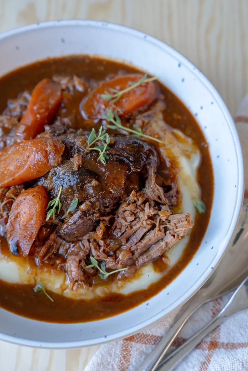 Glossy gravy poured over tender beef pot roast