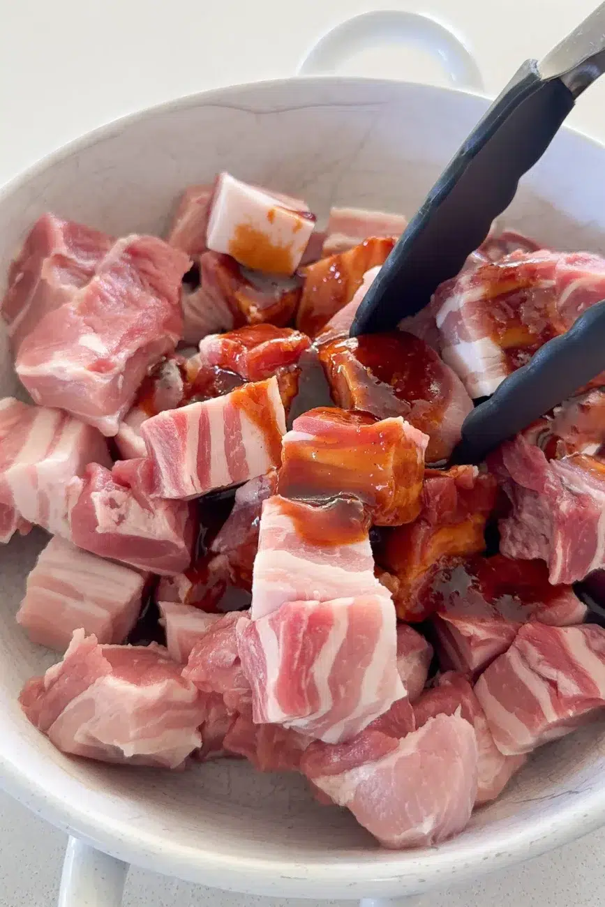 Marinade added to pork ready for mixing