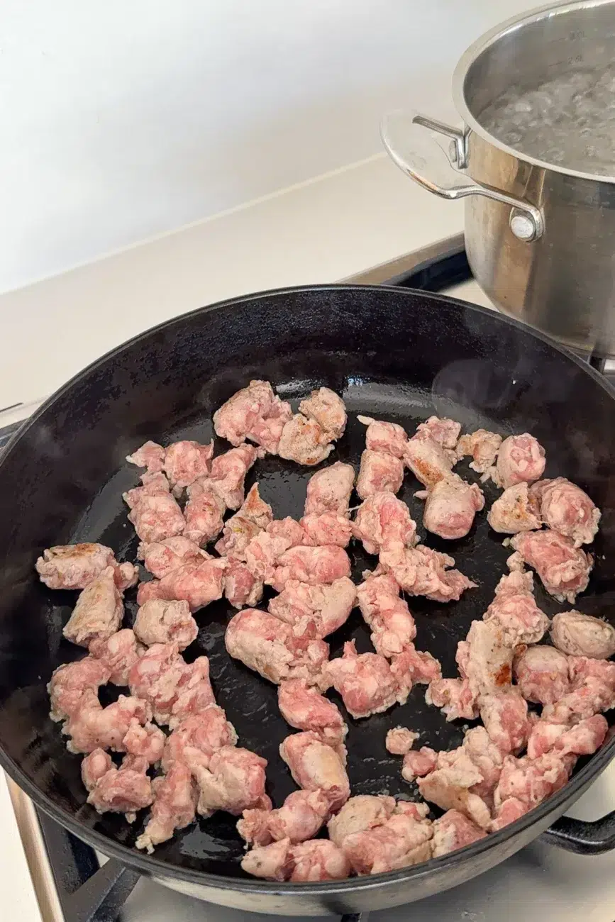 Sausages in pan broken up
