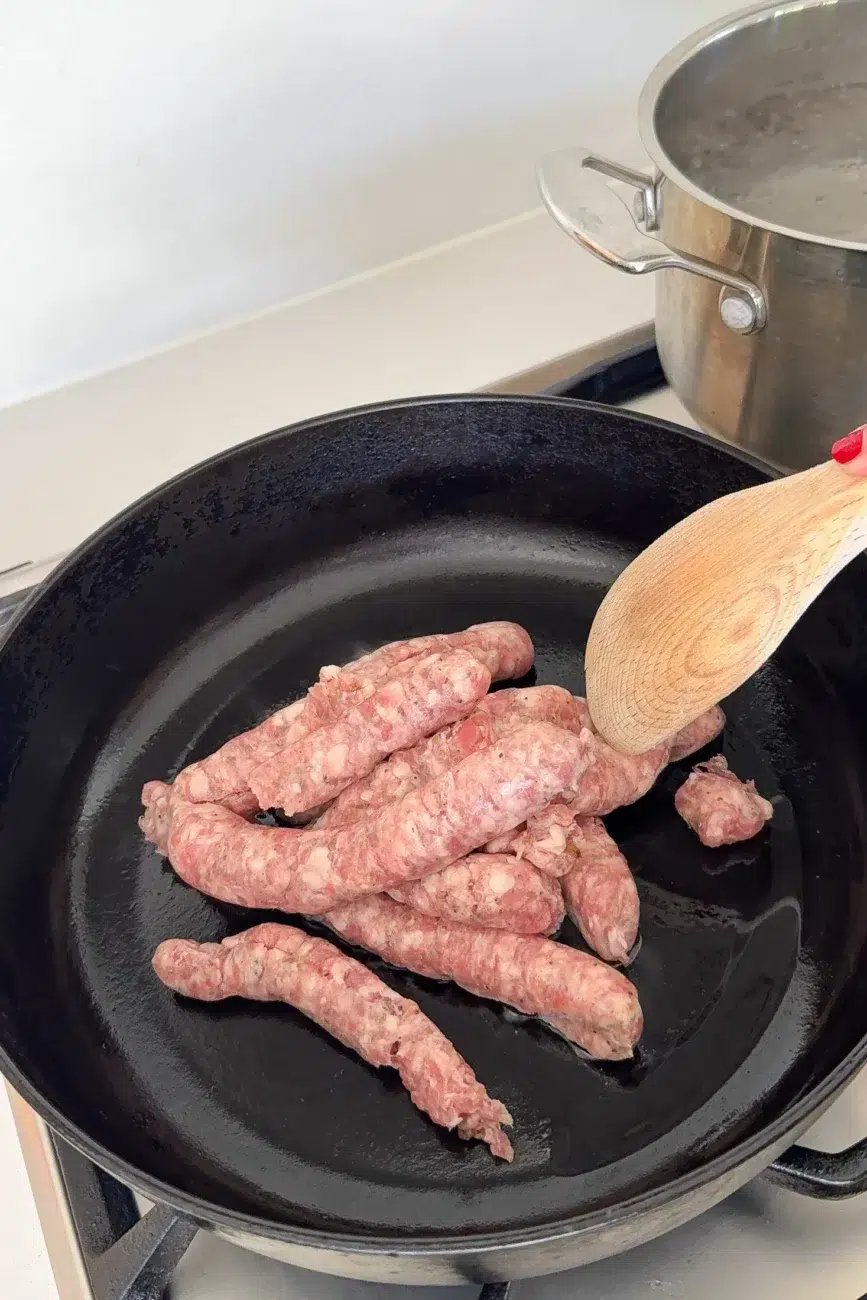 Sausages in pan with casings removed