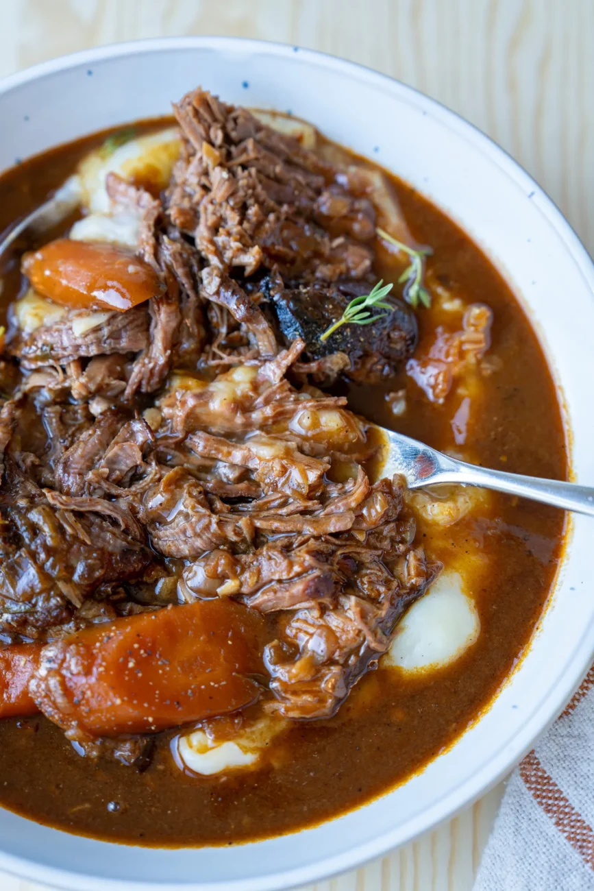 Tender beef pot roast with a fork