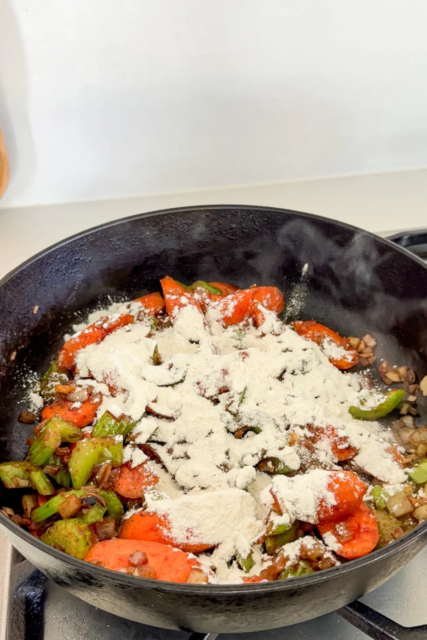 Vegetables sprinkled with flour ready to be stirred
