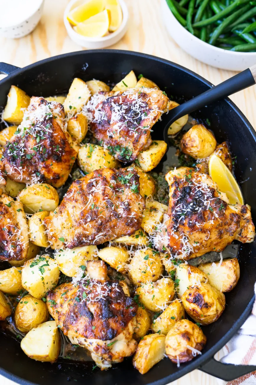 Chicken in baking dish with spatula