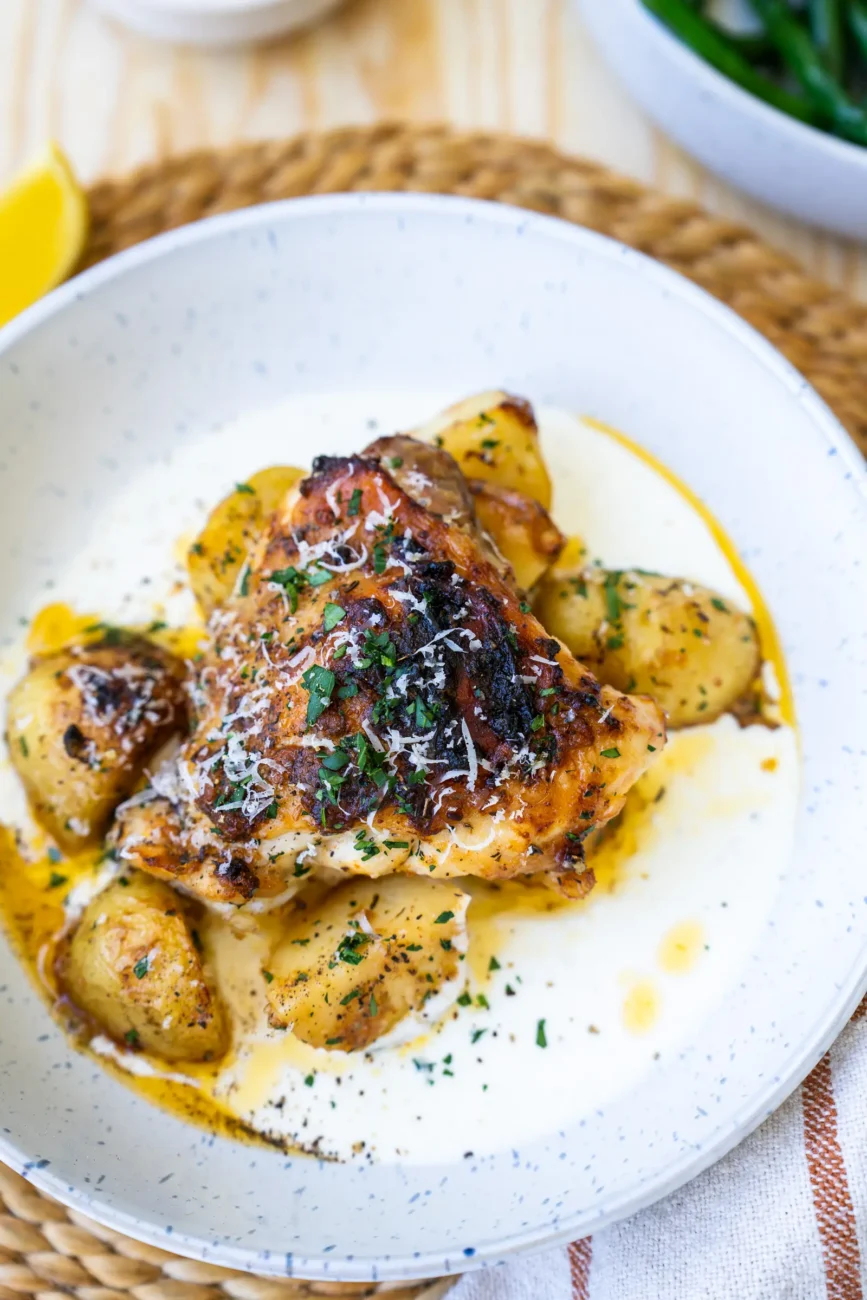 Chicken plated with sauce on base