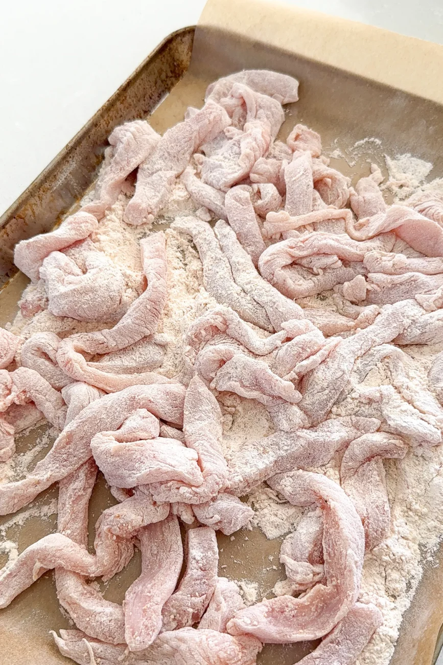 chicken fingers added to seasoned flour