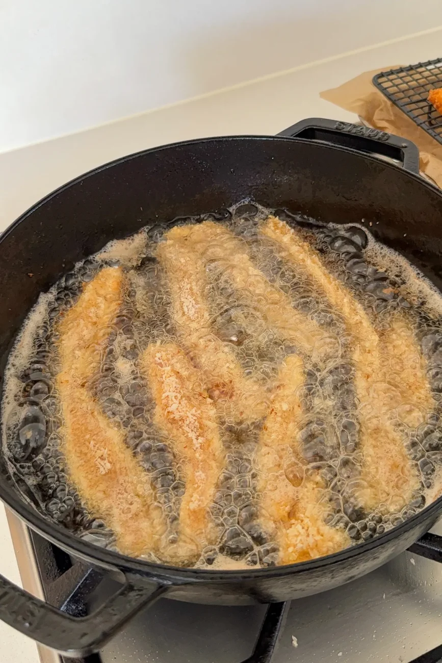 chicken fingers shallow frying in oil