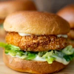 Close up crispy minced chicken burger in brioche bun