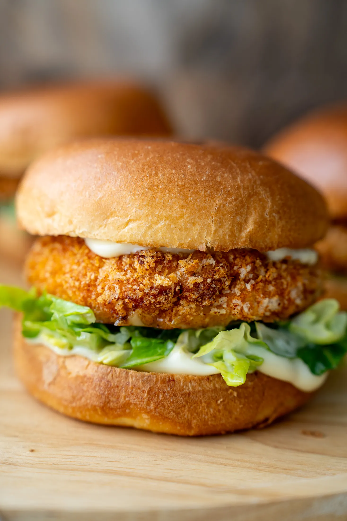 Close up crispy minced chicken burger in brioche bun