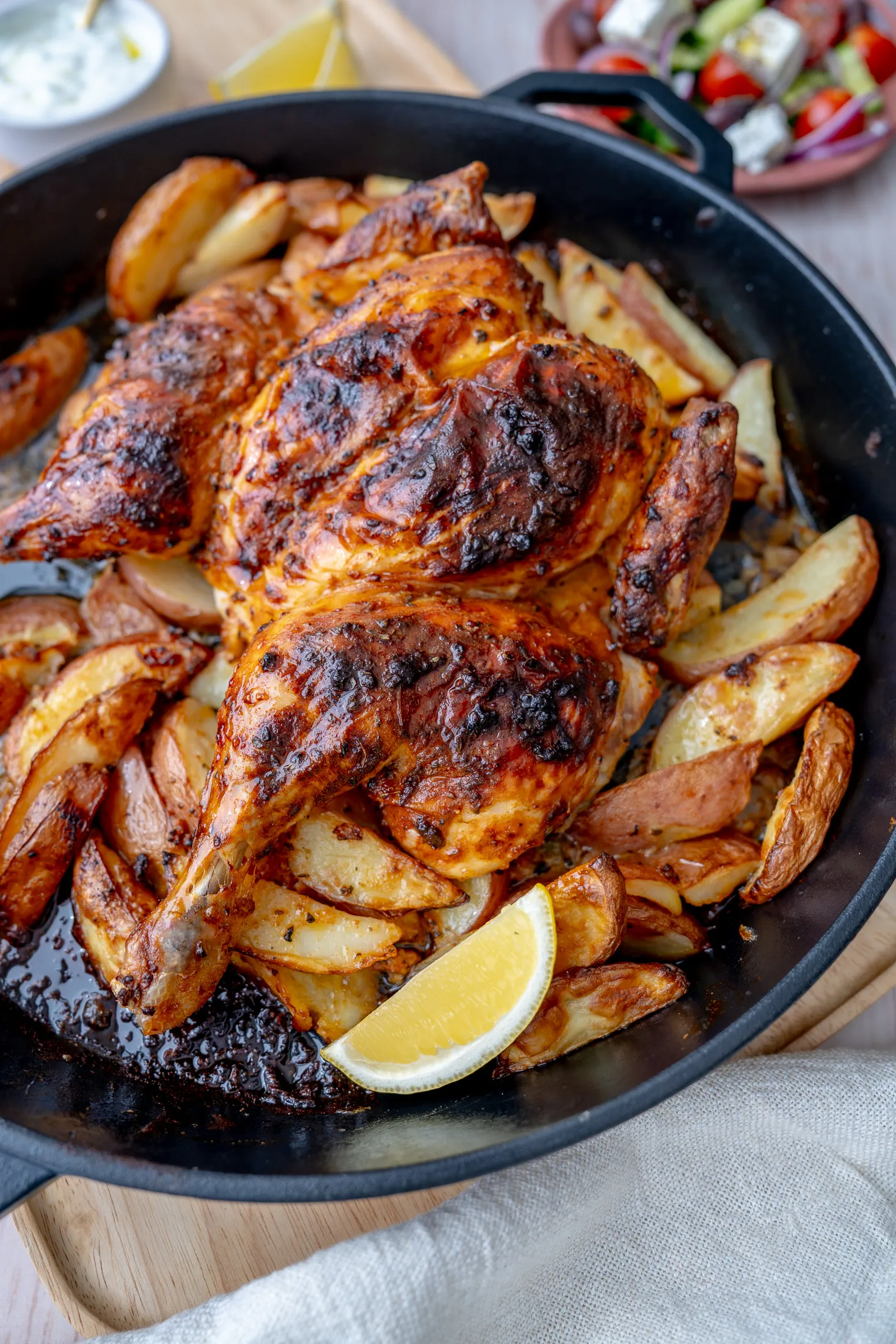 Finished chicken and potatoes in tray overhead shot