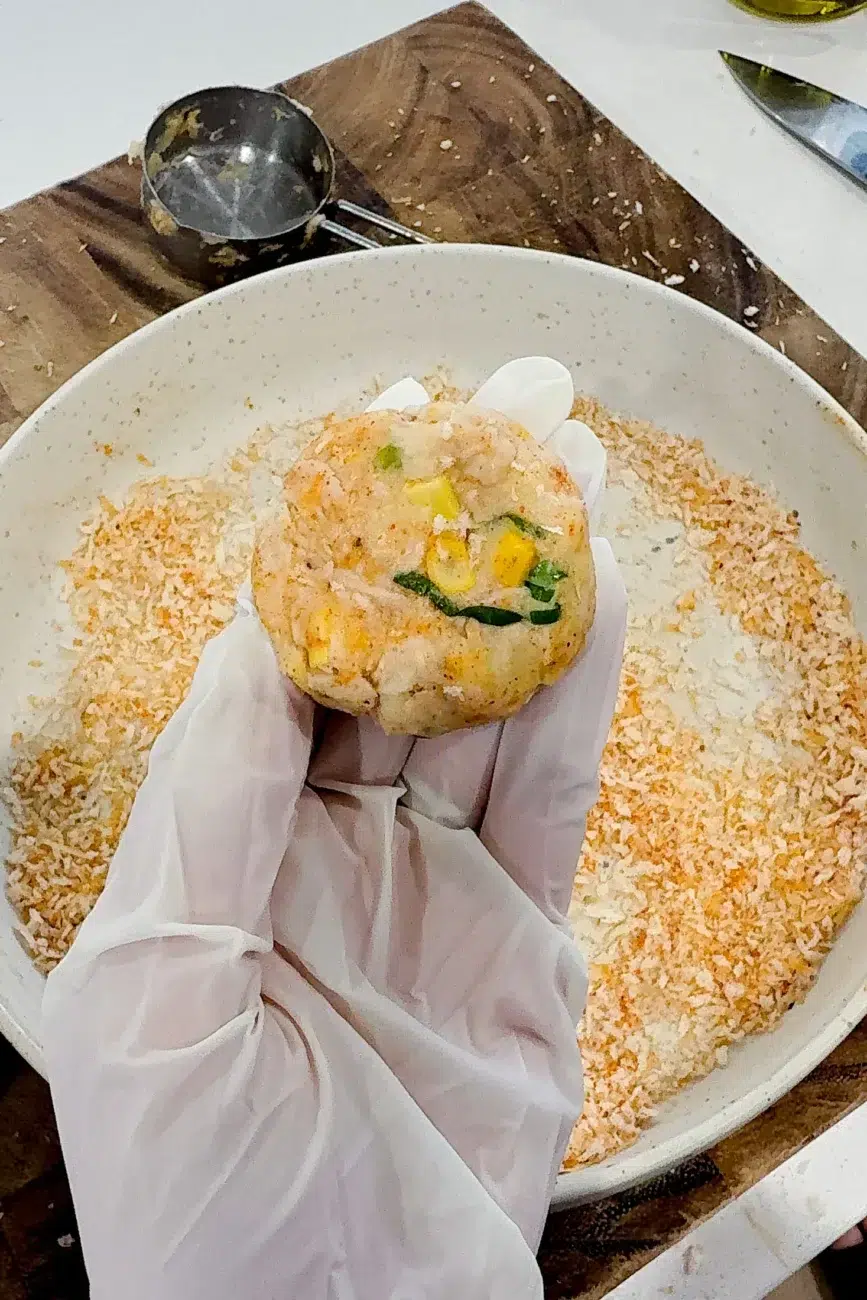 One shaped fish cake measured out with ¼ cup measure