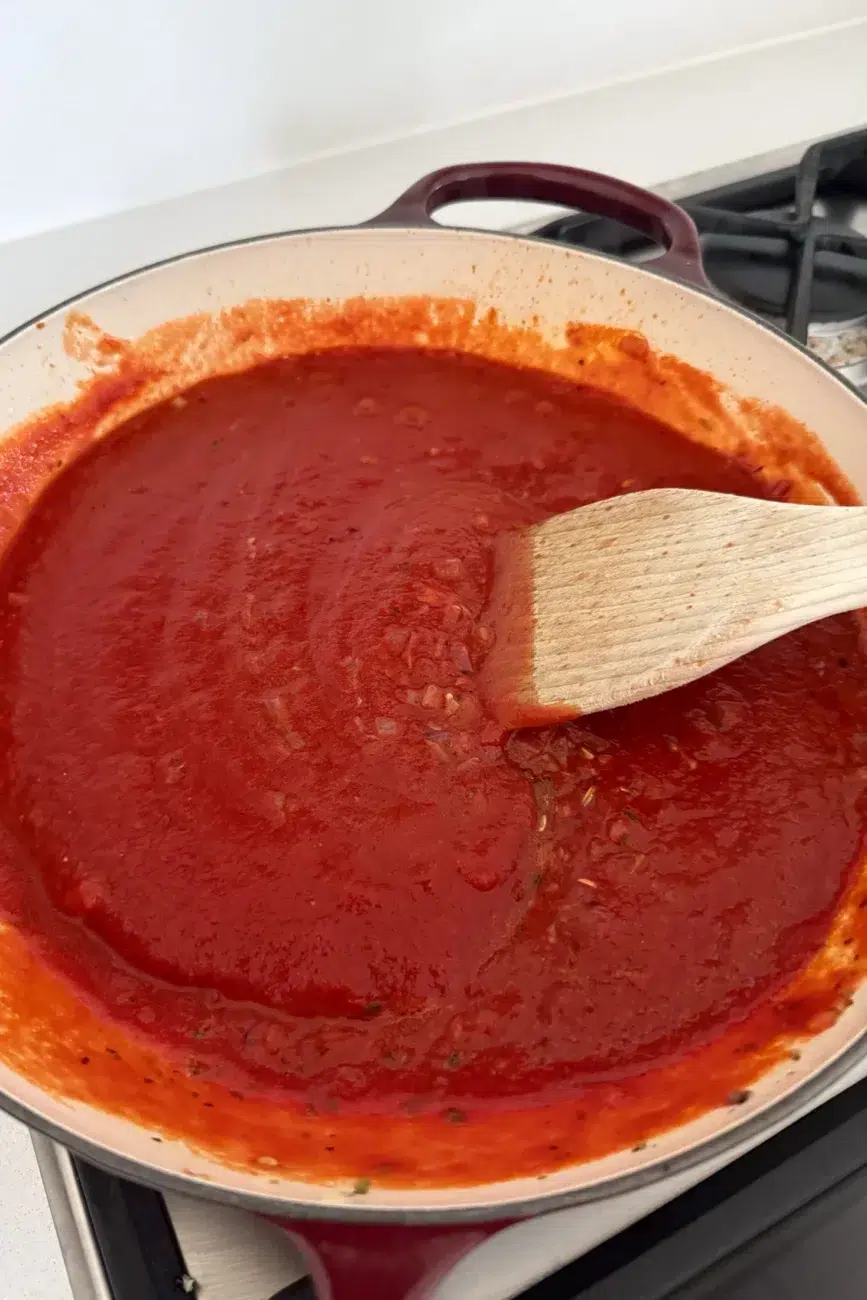 Remaining tomato and basil sauce ingredients added to pan