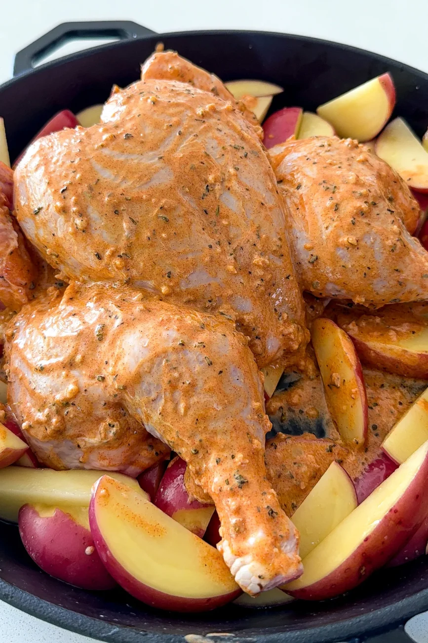 Spatchcoked chicken with marinade drizzled