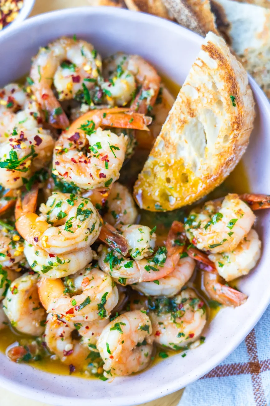 garlic prawns in bowl with bread