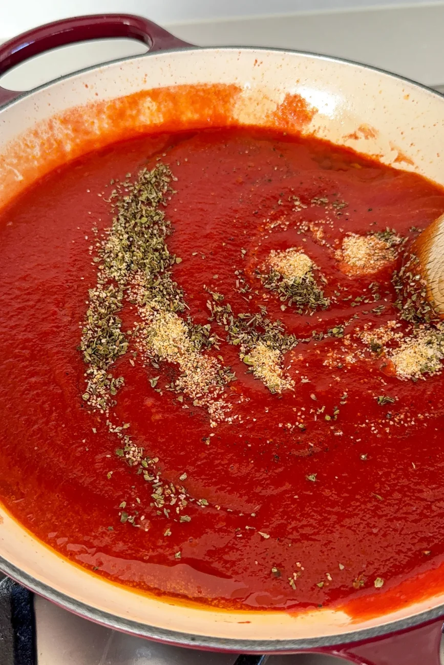 ingredients added to passata ready to be stirred in