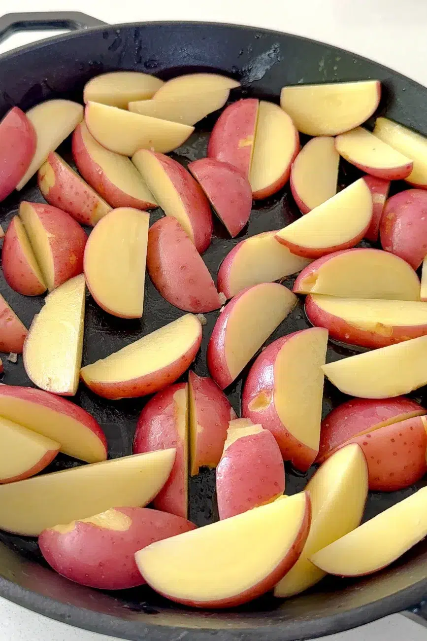 potatoes in tray ready to bake